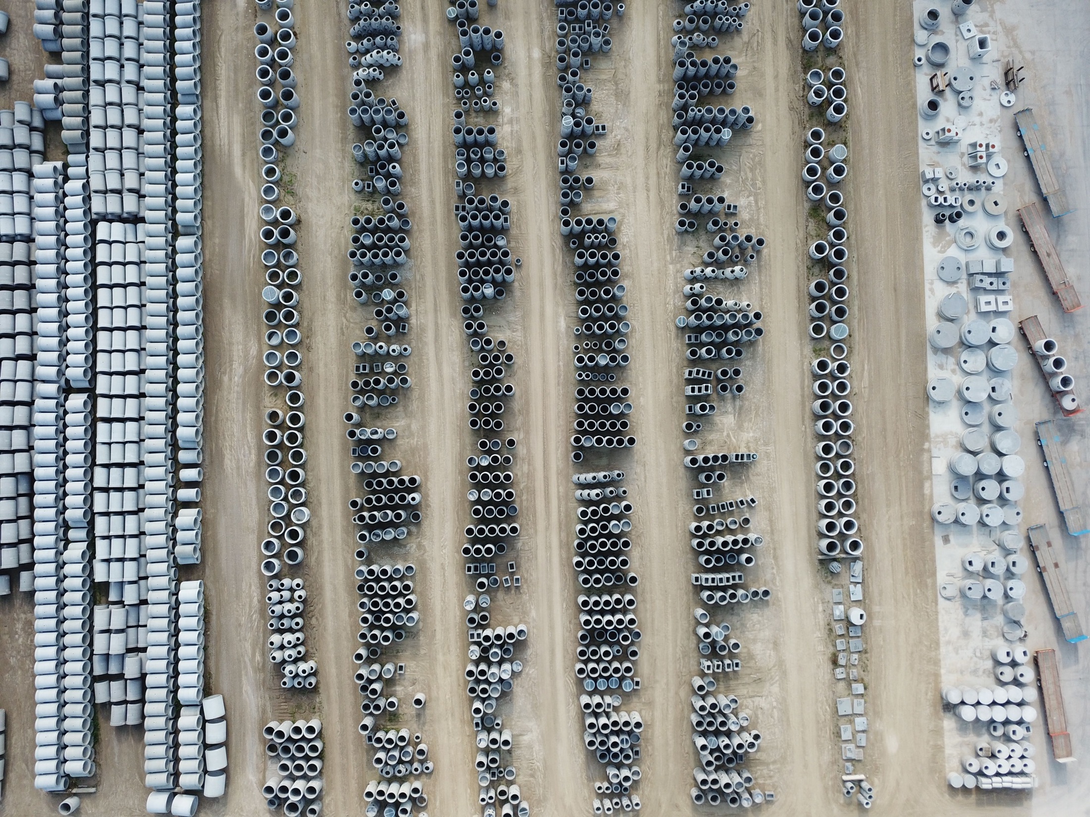 Concrete infrastructure components arranged in an industrial yard